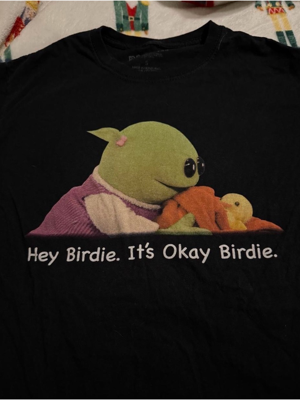 NaNa Black Graphic Tee with Green Character and Orange Accent